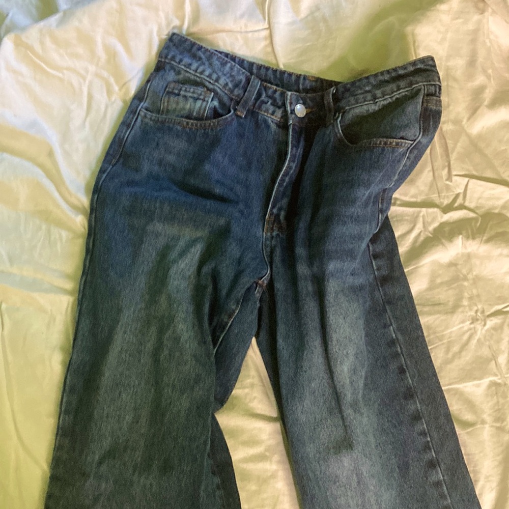 Dark wash straight leg jeans.